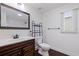 Updated bathroom features a modern vanity, framed mirror, black fixtures, and a tiled shower for a sleek design at 5221 4Th N Ave, St Petersburg, FL 33710