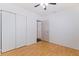 Bedroom with laminate floors, closet, and view of ensuite bathroom at 5221 4Th N Ave, St Petersburg, FL 33710
