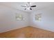 Bright bedroom with a ceiling fan, two windows, and laminate floors at 5221 4Th N Ave, St Petersburg, FL 33710