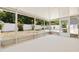 Enclosed lanai with a concrete floor and view of the backyard at 5221 4Th N Ave, St Petersburg, FL 33710
