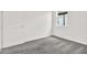 Bedroom featuring neutral walls, gray carpeting, and a standard closet door at 6019 Shorebird Br, Land O Lakes, FL 34638