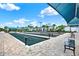 Picture of a bocce ball court area with shade structures, benches, and landscaping at 6019 Shorebird Br, Land O Lakes, FL 34638