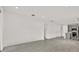 Open-concept living room with tile floors, connecting to the kitchen at 6019 Shorebird Br, Land O Lakes, FL 34638