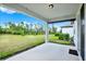 Covered patio with view of the expansive backyard and green space at 6019 Shorebird Br, Land O Lakes, FL 34638