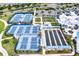 Recreational area featuring well-maintained tennis courts, bocce ball, and picturesque landscaping at 6019 Shorebird Br, Land O Lakes, FL 34638