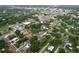 Wide aerial shot of the residential area, highlighting the homes, streets, and green spaces at 606 N Merrin St, Plant City, FL 33563