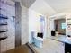 Bathroom featuring a tiled shower, modern toilet, and tiled floors at 606 N Merrin St, Plant City, FL 33563