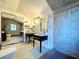Bright bathroom featuring double vanity sinks, tiled floors, and modern fixtures at 606 N Merrin St, Plant City, FL 33563