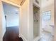 The bathroom features a shower, window, and a pedestal sink, providing a functional space at 606 N Merrin St, Plant City, FL 33563