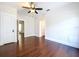 Bedroom featuring hardwood floors and white trim at 606 N Merrin St, Plant City, FL 33563