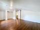 This room has hardwood floors and neutral paint providing a clean and bright atmosphere, ready for personalization at 606 N Merrin St, Plant City, FL 33563