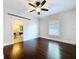 The bedroom features a ceiling fan and hardwood floors, complemented by a private ensuite bathroom at 606 N Merrin St, Plant City, FL 33563