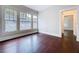 Bedroom with hardwood floors and multiple windows at 606 N Merrin St, Plant City, FL 33563