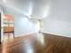 This bedroom is spacious with hardwood floors, natural light, and access to the ensuite bathroom at 606 N Merrin St, Plant City, FL 33563