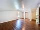 This bedroom has hardwood floors, natural light from the window, and access to the bathroom at 606 N Merrin St, Plant City, FL 33563