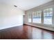 Bedroom with hardwood floors and windows at 606 N Merrin St, Plant City, FL 33563