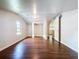 Attic bedroom with hardwood floors and natural light at 606 N Merrin St, Plant City, FL 33563
