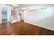 Bedroom featuring hardwood floors, white walls and shelving units at 606 N Merrin St, Plant City, FL 33563