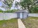 Side view of the garage with access door at 606 N Merrin St, Plant City, FL 33563