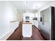 Bright kitchen boasts stainless steel appliances, butcher block countertops, and a functional center island cooktop at 606 N Merrin St, Plant City, FL 33563
