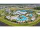 Aerial view of community pool and recreational facilities surrounded by lush landscaping at 6331 Voyagers Pl, Apollo Beach, FL 33572