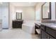 Bathroom with granite counters, double sinks, and a large soaking tub at 6331 Voyagers Pl, Apollo Beach, FL 33572