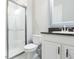 Clean bathroom with a glass-enclosed shower, modern vanity, and neutral color palette at 6331 Voyagers Pl, Apollo Beach, FL 33572