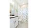 Bright bathroom featuring a dinosaur-themed shower curtain and contemporary vanity at 6331 Voyagers Pl, Apollo Beach, FL 33572