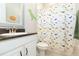 Cheerful bathroom with a dinosaur-themed shower curtain and modern vanity at 6331 Voyagers Pl, Apollo Beach, FL 33572