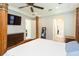 Bedroom showing Primary suite access with four-poster bed and ceiling fan at 6331 Voyagers Pl, Apollo Beach, FL 33572
