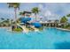 Resort-style pool with exciting water slides and ample seating for relaxation and fun at 6331 Voyagers Pl, Apollo Beach, FL 33572