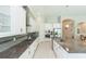 Bright kitchen featuring granite countertops, stainless steel appliances, and white cabinetry at 6331 Voyagers Pl, Apollo Beach, FL 33572