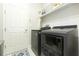 Efficient laundry room with modern washer and dryer units and ample storage space at 6331 Voyagers Pl, Apollo Beach, FL 33572