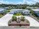 An aerial view of a beautiful single-story home with a circular driveway and manicured landscaping at 6511 10Th N St, St Petersburg, FL 33702