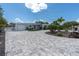 Charming home featuring a paved circular driveway, landscaping, and attached garage at 6511 10Th N St, St Petersburg, FL 33702