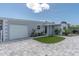 Exterior of home with paver driveway, attached garage, and well maintained landscaping at 6511 10Th N St, St Petersburg, FL 33702