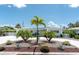Beautiful home featuring circular driveway, mature landscaping, and a welcoming entrance at 6511 10Th N St, St Petersburg, FL 33702