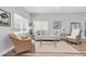 Bright and airy living room with neutral decor, wood-look floors, and comfortable seating at 6511 10Th N St, St Petersburg, FL 33702