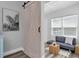 Living room featuring modern sliding barn door and contemporary furniture at 6511 10Th N St, St Petersburg, FL 33702