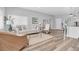 Bright and open living room featuring wood-look floors, neutral decor, and ample natural light at 6511 10Th N St, St Petersburg, FL 33702