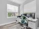 Bright office featuring a large window, modern desk, and ergonomic office chair at 6511 10Th N St, St Petersburg, FL 33702