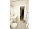 Clean and modern bathroom featuring marbled tile, gray vanity, and updated fixtures at 7684 Oakhurst Rd, Seminole, FL 33776