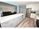Modern open kitchen showcases updated stainless steel appliances and seamlessly connects to the adjacent living areas at 7684 Oakhurst Rd, Seminole, FL 33776