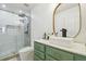Updated bathroom with a green vanity, modern sink, and sleek gold accents at 9329 Wellstone Dr, Land O Lakes, FL 34638