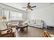 Cozy living room with large windows and comfortable seating perfect for relaxing at 9329 Wellstone Dr, Land O Lakes, FL 34638