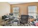 Home office with neutral walls and multiple windows providing natural light at 9329 Wellstone Dr, Land O Lakes, FL 34638