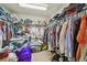Spacious walk-in closet featuring extensive shelving and hanging space for clothes and accessories at 9329 Wellstone Dr, Land O Lakes, FL 34638