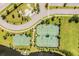 Enjoy an active lifestyle with community amenities including tennis and basketball courts nestled by a beautiful lake at 9839 Lemon Drop Loop, Sun City Center, FL 33573