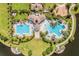 A luxurious community pool and clubhouse offer residents a resort-style living experience with ample lounging and social space at 9839 Lemon Drop Loop, Sun City Center, FL 33573