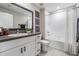 Bathroom with a granite countertop vanity, framed mirror, and a shower-tub combination at 9839 Lemon Drop Loop, Sun City Center, FL 33573
